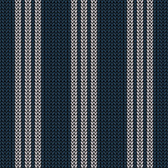 Knitted pattern in dark blue and white with vertical stripes. Seamless dark knit texture for winter scarf, hat, top, socks, or other modern everyday textile design.