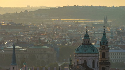Spires of the old town and St Nicolas church at sunrise timelapse. czech republic, prague