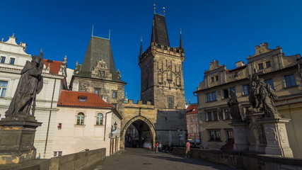 Fototapeta na wymiar A view along Charles Bridge in Prague towards the Lesser Quarter in the morning timelapse .