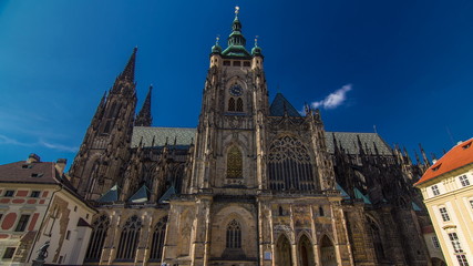 Fototapeta na wymiar St. Vitus Cathedral timelapse in Prague surrounded by tourists.