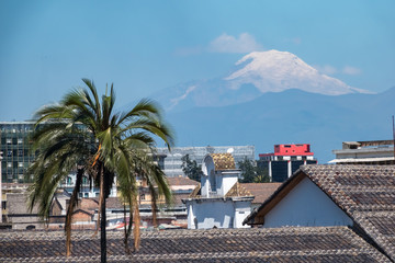 Fototapeta na wymiar View of the Cotopaxi volcano from the historical center of Quito, Ecuador