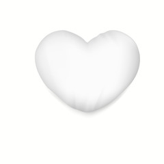 White heart pillow with soft shadow.