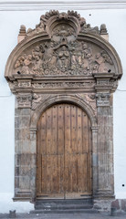 Fototapeta na wymiar Church portal, historical center of Quito, founded in the 16th century on the ruins of an Inca city, Ecuador