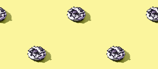 doughnut seamless pattern. White and black color. Tasty unhealthy food. Yellow background. Many donuts with shadow. Chocolate bake snack. One size