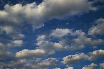 Beautiful, spring clouds in the blue sky, which portend the change of weather.
