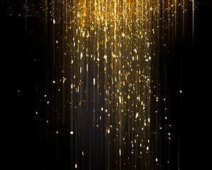 Gold sparkling star dust. Gold sparkles on a black background. shiny background. Gold glittering...