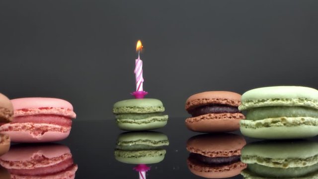 spread macaroons and a burning candle for the holiday