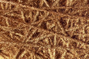 Abstract background of gold threads.