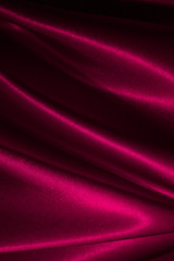 Beautiful satin drapery. Satin pink fabric. Abstract design.