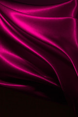 Beautiful satin drapery. Satin pink fabric. Abstract design.