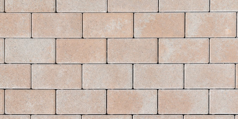 Textured stone tilled wall texture masonry brick abstract background of sandstone facade for wallpaper