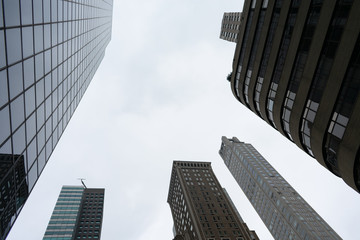 Looking up at Old and New Skyscrapers in Midtown Manhattan of New York City