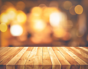 Wood texture table top (counter bar) with blur light gold bokeh background