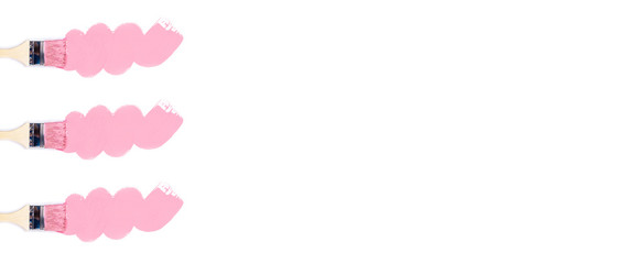 Isolated white background with three construction brushes.