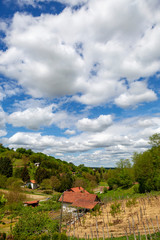 Fototapeta na wymiar Sunny day with clouds in a rural countryside of Croatian north