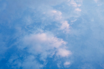 Naklejka na ściany i meble White clouds in blue sky from above
