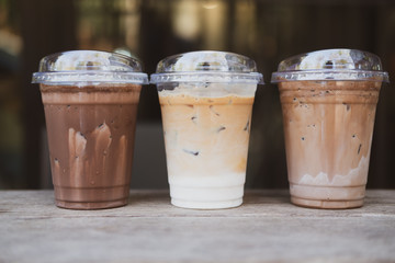 Three glasses of iced coffee drinks on table