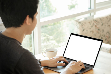 Mockup image of a man working at the laptop