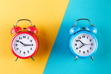 Two old style alarm clocks on light color background. Alarm clock with place for text. Time management concept, business planning