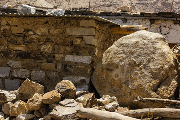 An ancient prayer stone in the Himalayan village of Nako in Kinnaur with Tibetan prayer chants...