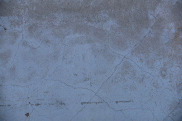 Cement wall with cracks in industrial building, surface for your design and texture background.