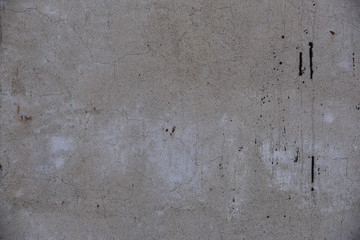 Cement wall with cracks in industrial building, surface for your design and texture background.