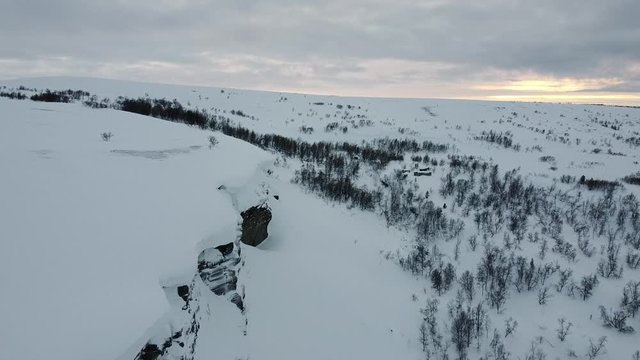 Snowdrift and cabins at a mountain in Finnmark, Norway