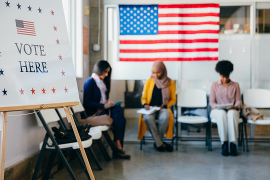 Diverse Voters Filling Out Registration Forms