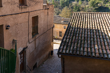 Fototapeta na wymiar Aerial view of the lower streets of the medieval town of Mura, Catalonia, Spain