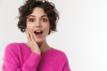 Image of excited beautiful woman expressing surprise at camera