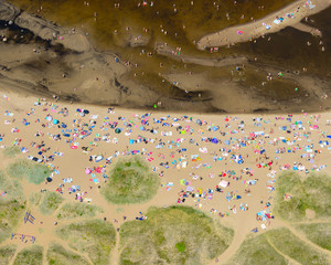 Aerial view of people sunbathing on beach, Rullsand, Uppland, Sweden