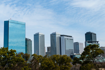 Fototapeta na wymiar Osaka, Japan cityscape with blue sky at sunny day, copy space. beautiful of urban landscape, skyline city office buildings, on Sky clouds background. Buildings, town ,city Asia concept