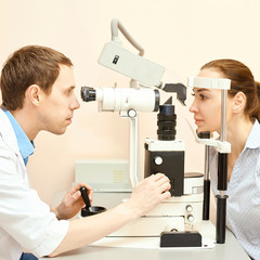 ophthalmologist male doctor in exam optician laboratory with female patient. Men eye care medical diagnostic. Eyelid treatment. Square
