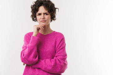 Image of displeased brunette woman posing and looking at camera