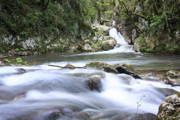 Long exposure of  the stream of water in the river flowing between the rocks in the mountains national park.
