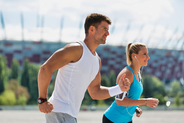 Young couple excersising in park