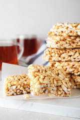 Delicious rice crispy treats on light grey table