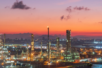 Fototapeta na wymiar Petrochemical Industrial.. Oil refinery factory and oil storage tank at twilight and night.