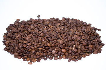 Roasted coffee beans pile isolated on white background. Selective focus.