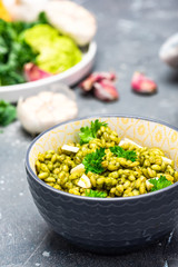 Vegetarian Dish in Bowl. Groats with Green Kale and Garlic. Top Down View