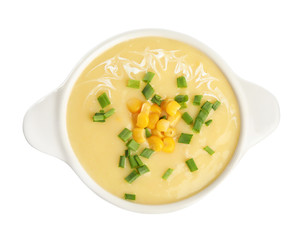 Delicious corn cream soup isolated on white, top view