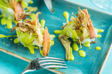 codfish carpaccio with fried artichoke and tuna bottarga