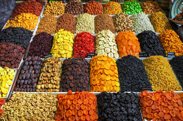 A large variety of dried fruits and nuts are on sale in the market. Tasty and healthy food.