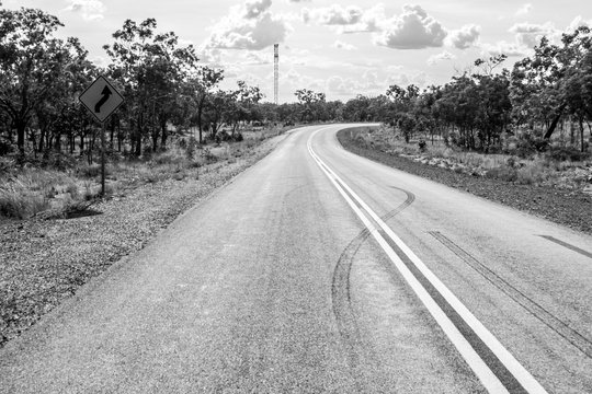 Black and white empty asphalt road through australian outback, Northern Australia © Victoria