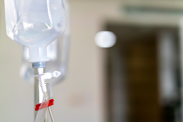 Sodium chloride or saline solution fluid iv irrigation transparent drip bag and tubing at room in hospital