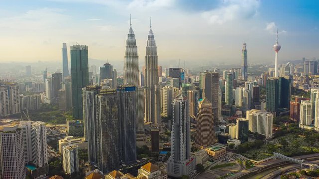 aerial view hyperlapse 4k video of Kuala Lumpur city center view during dawn overlooking the city skyline in Federal Territory, Malaysia. petronas twin towers hyper lapse.