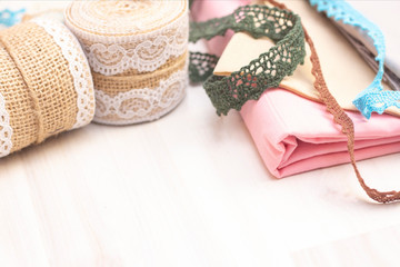 Fototapeta premium Background sewing. Ribbons, lace for sewing and creativity. Background with copy space.