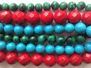 Women's jewelry beads made of coral, malachite and turquoise.