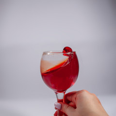 Wine glass with elegant splashes on the white
