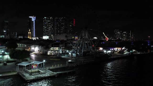 Night aerial video Skyviews Miami ferris wheel at Bayside Marketplace